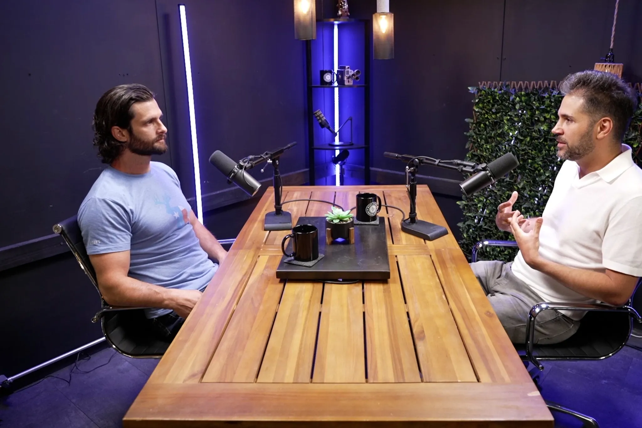 two men talking across a cable from each other