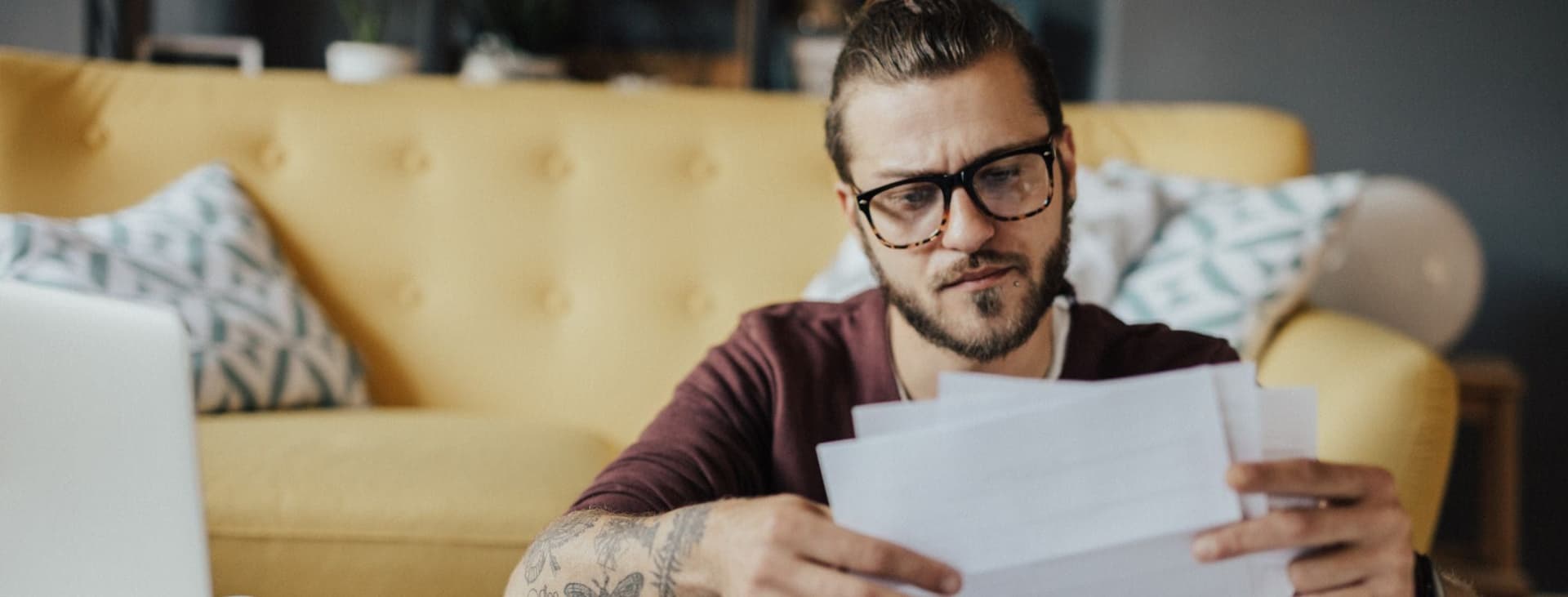 Man Looking at Financial Statements