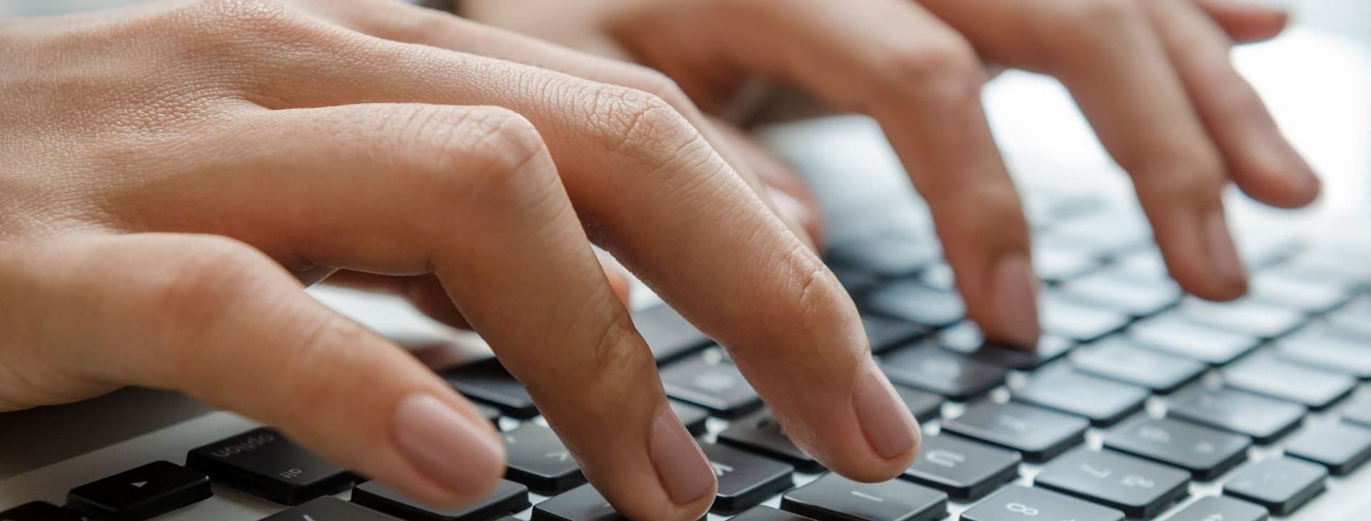 Call Center Agent Typing on Keyboard